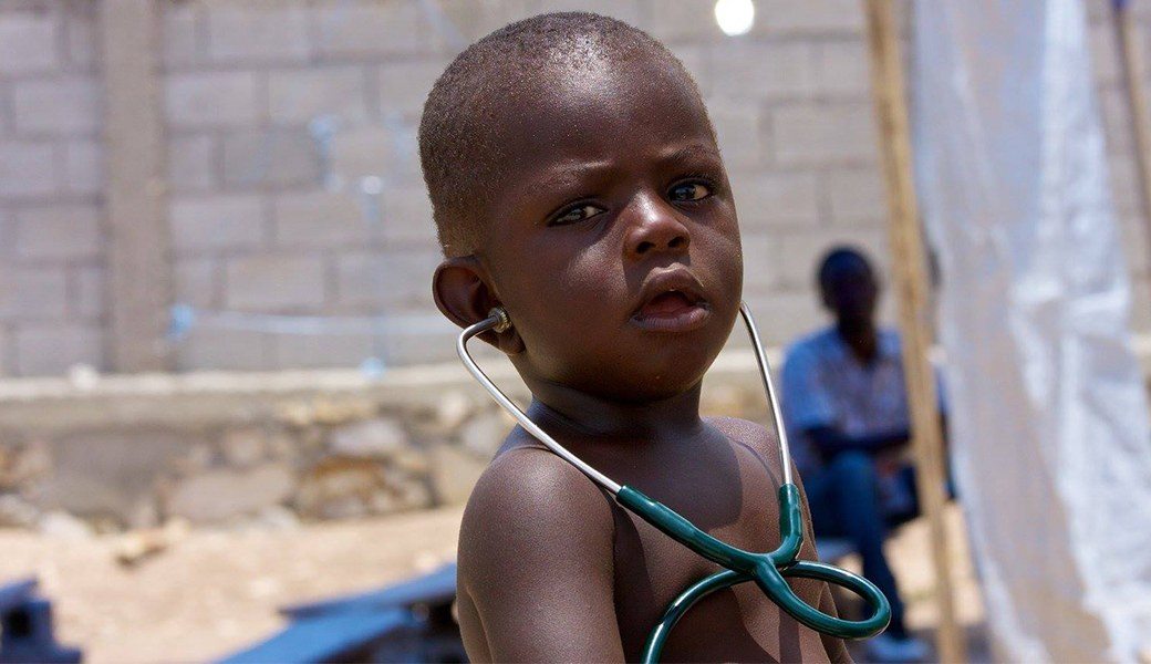Child with stethoscope on mission trip