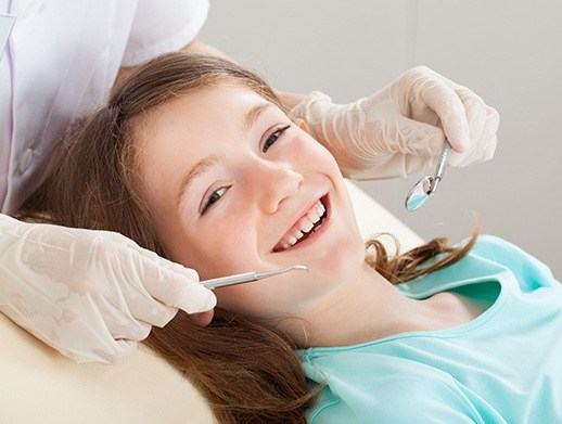 girl getting dental checkup