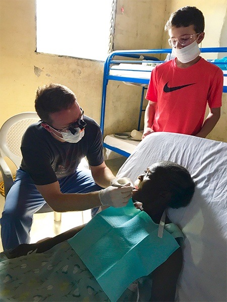 Dr. Weiss treating patient on mission trip
