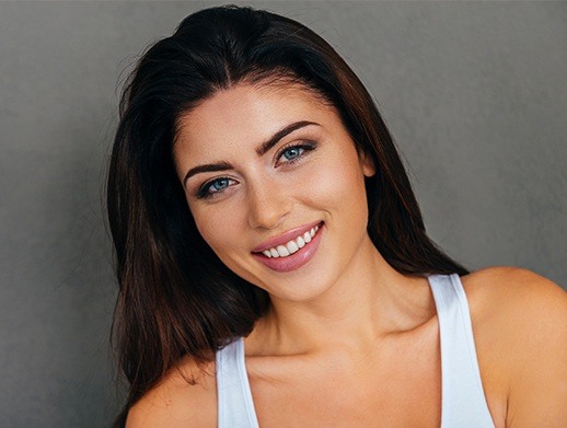 Smiling woman with porcelain veneers