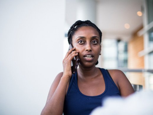 concerned woman talking on the phone