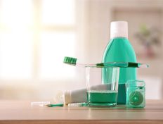 oral hygiene products sitting on a bathroom counter