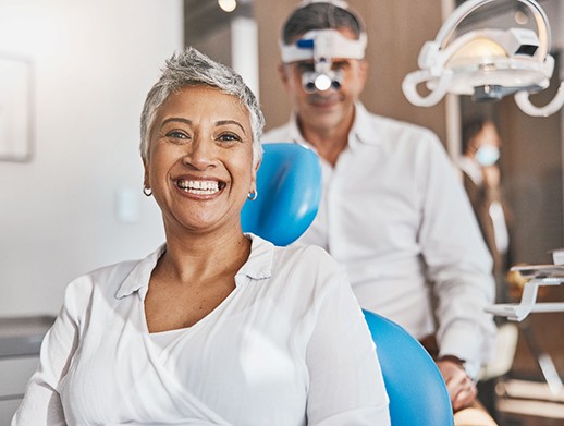 A woman smiling at the dentist