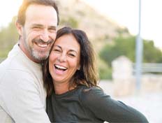 Couple smiling together outside