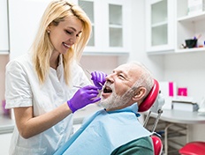 Woman smiling while visiting her implant dentist in Skokie