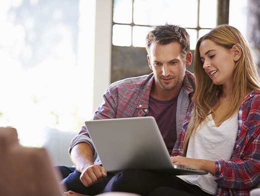 couple looking at a laptop together