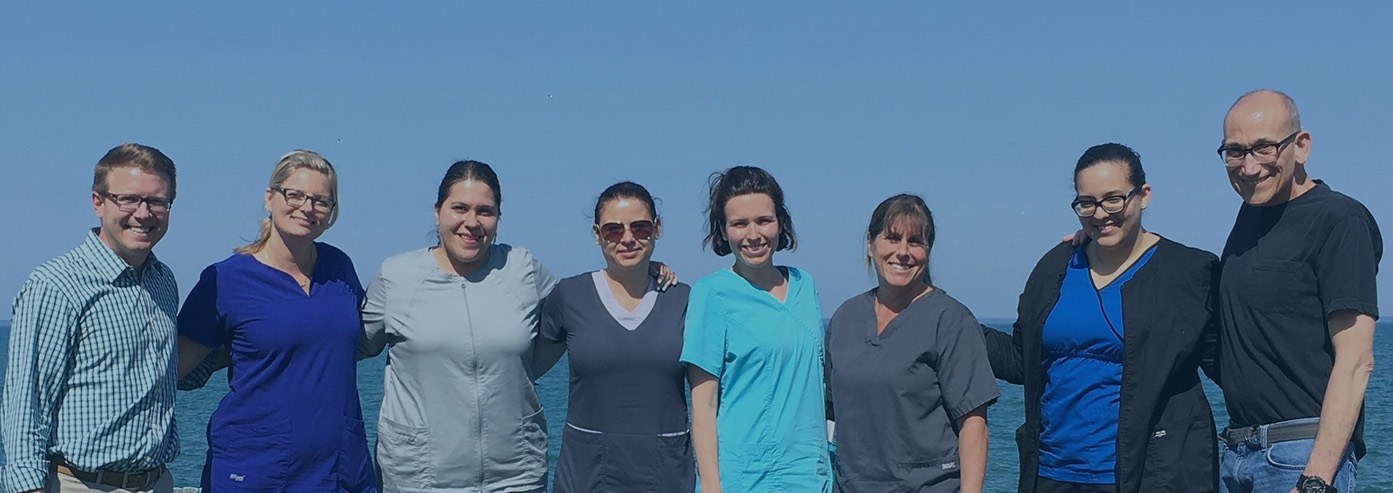 Skokie dentists and dental team members smiling outdoors