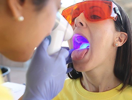 woman getting oral cancer screening