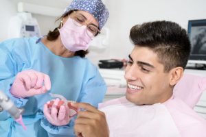 dentist showing Invisalign to patient 