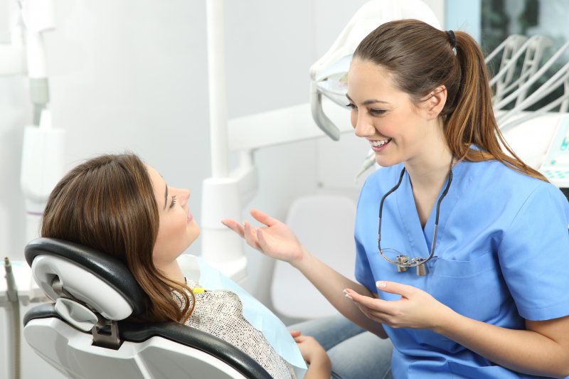 dentist explaining dental implants to patient