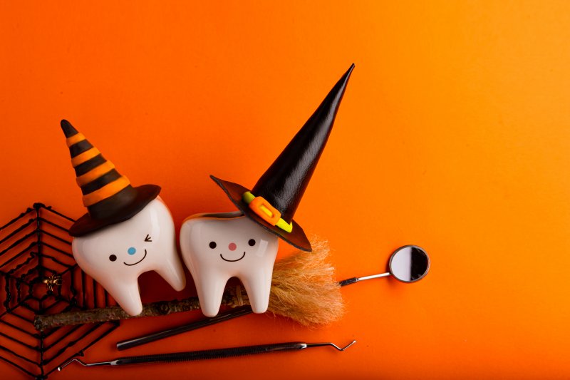Model teeth decorated with Halloween witch hats